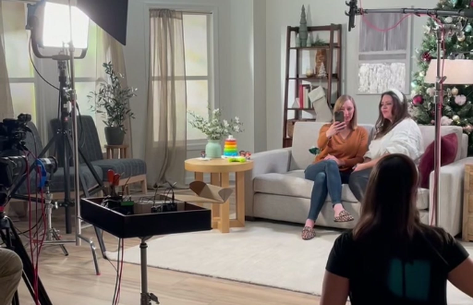 Behind the scenes of a social content production, with lighting, camera equipment and talent on set